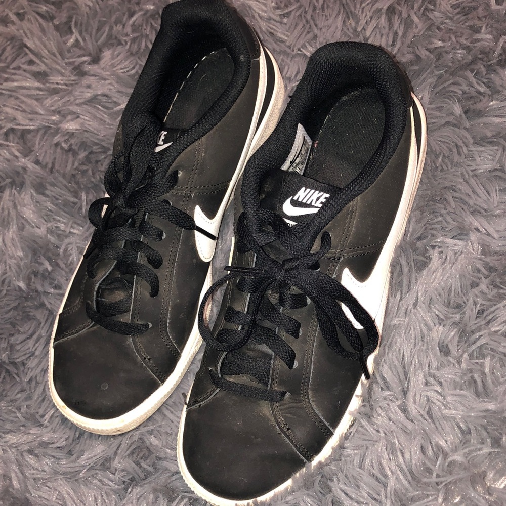 Well worn women’s Nike Black and White Low-Top Sneakers size 8